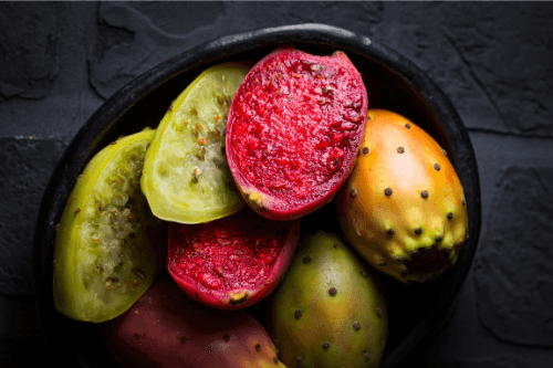 Prickly pears cut open, displayed in a bowl