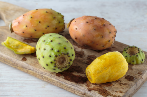 Prickly pears laying on a cutting board