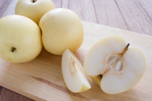 Sliced asian pear fruit on a cutting board