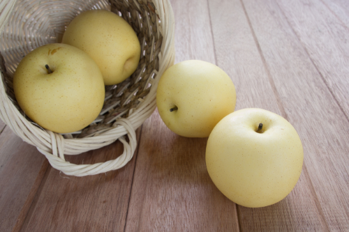 Asian pear fruit laying in a basket