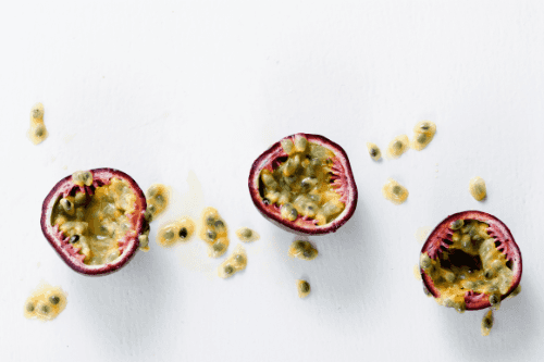 Passion fruit displayed on white paper