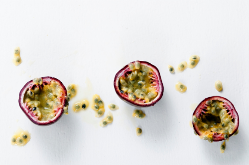 Half passion fruit on white background