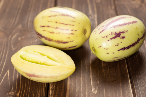 Pepino melon fruit displaying on a wooden table