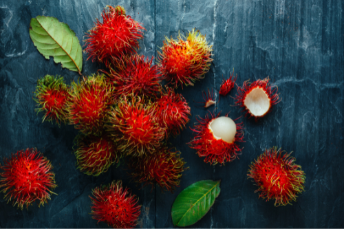 Rambutans displaying on a gray table